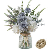 Leftover silk dahlia flowers in vase offer long-lasting color for table centerpieces.