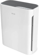 Levoit Vital 100 front view in a compact bedroom, showcasing quiet performance.