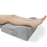LightEase memory foam leg pillow elevating legs for circulation and swelling relief.