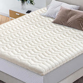 LILYVIBEBEARHAPPY premium foam topper unrolled on bed for even support.
