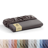 Linen Home king charcoal fitted sheet on bed with hotel-crisp percale feel for cool comfort.