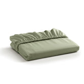 Linen Home sage-percale-fitted-sheet on bed delivers a crisp, cool sleep surface.