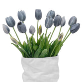 LINSIE orange tulips in three bundles ready for display in a centerpiece.