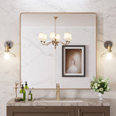 LOAAO gold bathroom mirror with rounded rectangle frame for clear reflections.