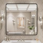 LOAAO 30x30 inch black metal framed mirror for crisp grooming reflections.
