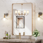 LOAAO rounded gold bathroom mirror with brushed frame and distortion-free reflection
