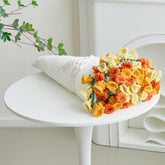 Longhui Bedding crochet flower bouquet throw draped on a sofa adds cozy charm.