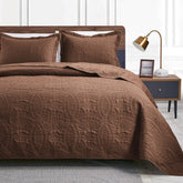 Love's cabin coin-pattern king quilt on bed for all-season styling and soft comfort.