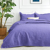Love's cabin coin pattern quilt on a bed provides all-season comfort.