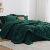 Love's cabin king-size comforter set in dark green for a plush, inviting bed look.
