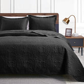 Love's cabin king-size quilt set on bed with coin-pattern coverlet for year-round comfort.