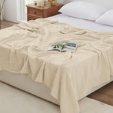 Love's cabin muslin blanket closeup shows six breathable layers for lightweight warmth.