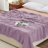 Love's cabin muslin blanket close-up shows six-layer cotton texture for breathable comfort.