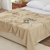 Love's cabin 6-layer muslin blanket on bed in khaki, all-season warmth.