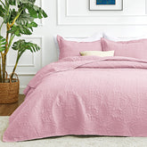Love's cabin queen quilt pink coverlet on bed for a cozy mood