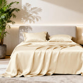 Love's cabin satin queen flat sheet in beige, smooth texture for gentle night comfort.