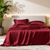 Love's cabin satin queen flat sheet in burgundy with a silky finish for smooth skin contact.