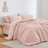 Love's cabin seersucker pink twin comforter shows soft texture for cozy warmth.