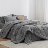 Love's cabin twin comforter grey fabric close-up, ultra-soft feel for cozy nights.