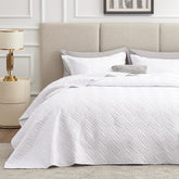 Love's cabin king-size quilt set in crisp white for year-round use and easy decor matching.