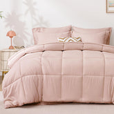 Love's Cabin twin comforter set on a bed in blush pink with a soft, inviting texture.