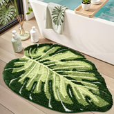 LUMI Monstera leaf design rug enhances tropical bathroom decor and soft underfoot comfort.