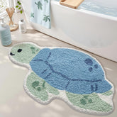 LUMI sea turtle bath mat in blue provides quick-drying comfort after showers.