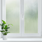 LUTE Reeded glass window film enhances privacy while diffusing natural light.