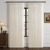 LuxuNap pinch-pleated curtain with sharp folds for refined living room styling.