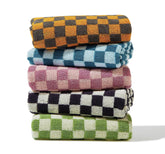 Madi-Cadi hand towels with checkered pattern in five colors for bathroom decor.