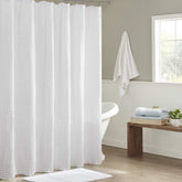 Madison Park Arlo waffle texture shower curtain in white adds spa-like texture.