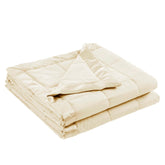 Madison Park Windom blanket folded on a cream bed for soft warmth.
