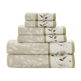 Madison Park Serene bath towels feature jacquard leaf pattern and embroidered hem for elegant bathroom decor