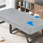 Magik & Kover cot mattress pad waterproof quilted top protects mattress during camping.