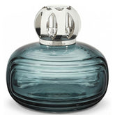 MAISON BERGER Enigma blue bottle showcases odor-neutralizing potential for living rooms.