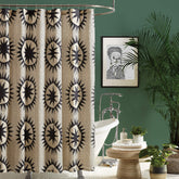 Makers Collective Jungalow Soleil curtain with geometric sun pattern for chic bathrooms.