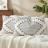 Mecatny boho outdoor pillow cover with navy tassels on cream background for patio decor