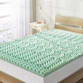 Mellow balance topper on bed shows 5 zone comfort for targeted support.