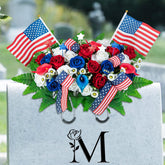 Memobloom patriotic rose saddle on grave with red, white, and blue blooms.