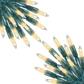 Minetom clear Christmas lights on a 40 ft run illuminate indoor trees with even brightness.