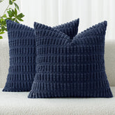 MIULEE corduroy pillow cover in dark blue enhances sofa coziness with a striped accent.