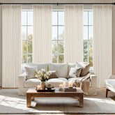 MIULEE pinch-pleated linen curtains in ivory offer privacy while filtering natural light.
