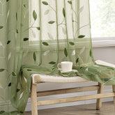 MIULEE sage green sheer curtains with embroidered leaves, ideal for bright living spaces.