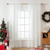 MIULEE ivory sheer curtain panel with rod pockets adds soft privacy and light filtration.