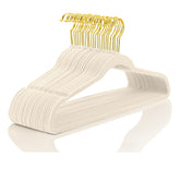 MIZGI premium velvet hanger in ivory keeps dresses organized and wrinkle-free.