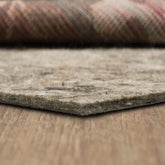 Mohawk Home non-slip pad with one-half-inch cushion stabilizes rugs on any surface.