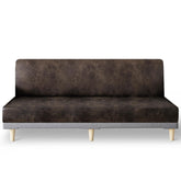 Molasofa leather-like stretch futon slipcover in dark brown protects and refreshes a sofa bed.