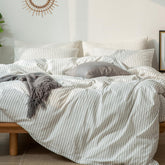 MooMee striped duvet cover set in white and dark grey for breathable, cool sleep.