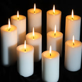 MOSROAD 12-pack white pillar candles for warm ambiance.