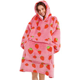 Narecte strawberry oversized hoodie blanket worn for cozy lounging at home.